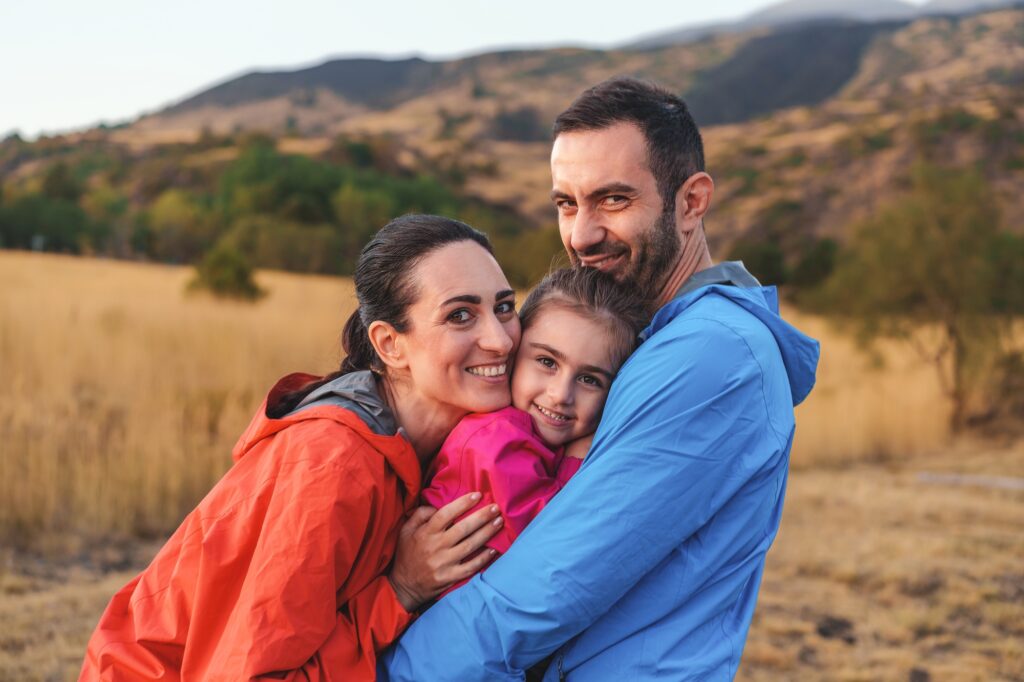 Smiling family enjoying the outdoors, representing happy patients of Brookside Family Dentistry in O'Fallon, MO